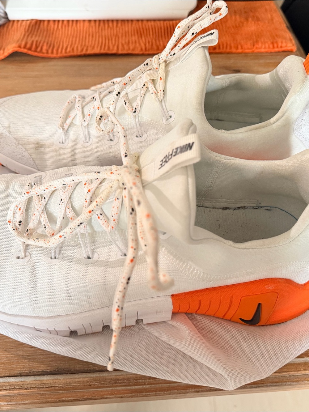 Nike Women’s White Sneakers with Orange Accents